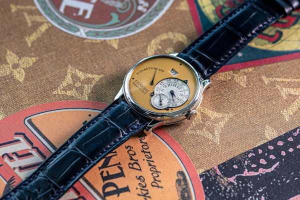 F.P. Journe watch on an ornate background