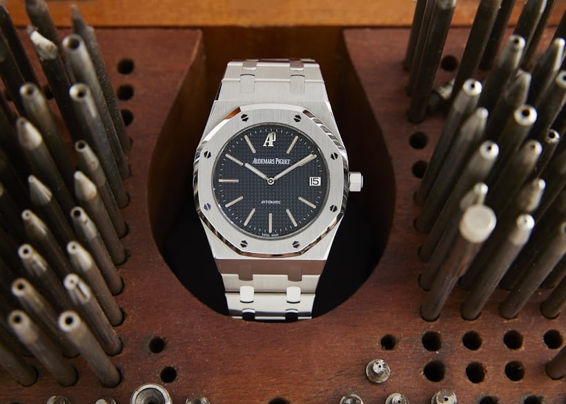 An Audemars Piguet Royal Oak Jubilee Limited Edition 14802ST.OO.0944ST.01 sits upright in a drawer full of small screwdrivers.