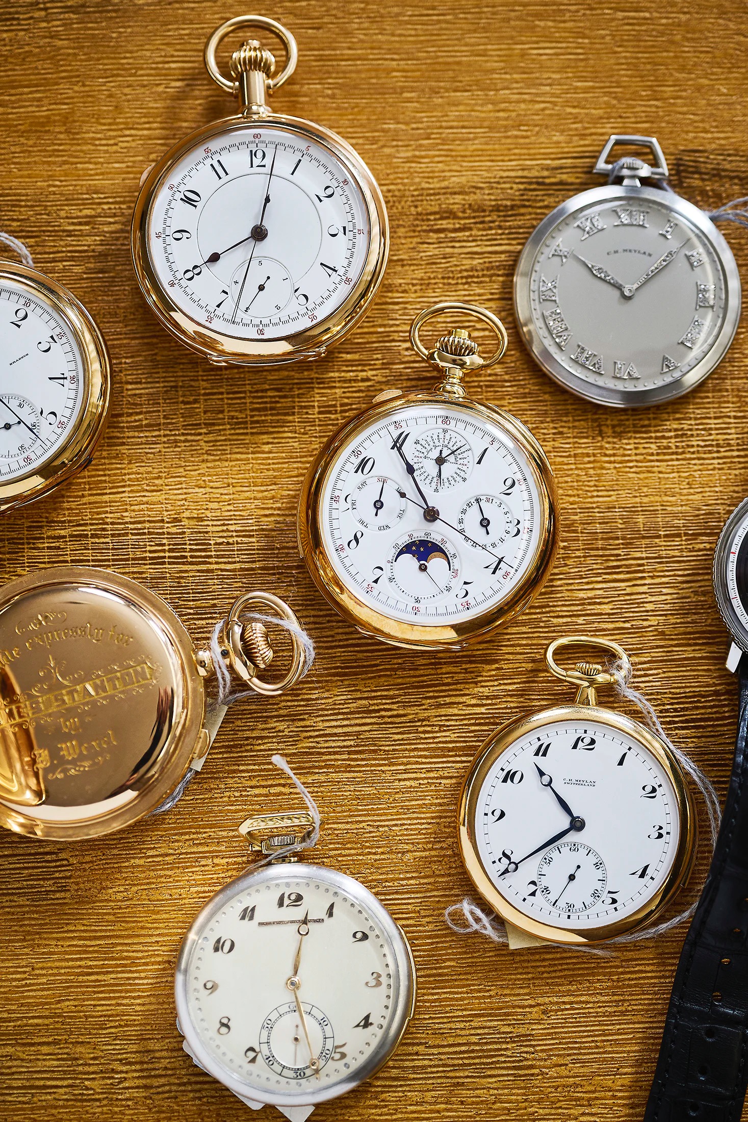 pocket watches on a table