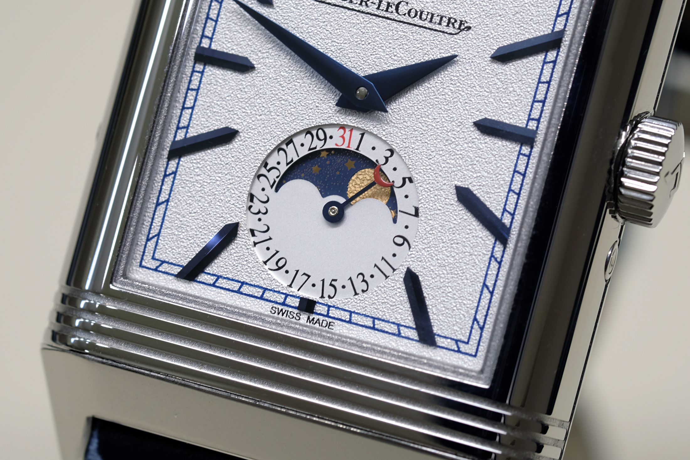 The watch features a hand-hammered moon-phase on one side. 