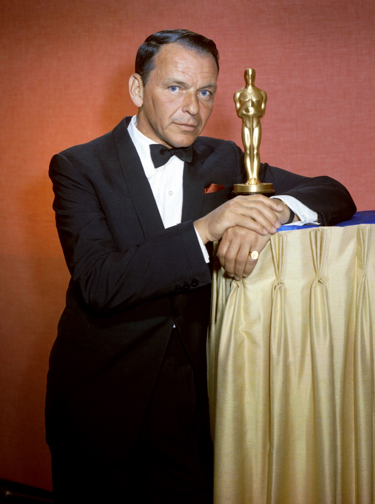 frank sinatra in black tie, with wristwatch