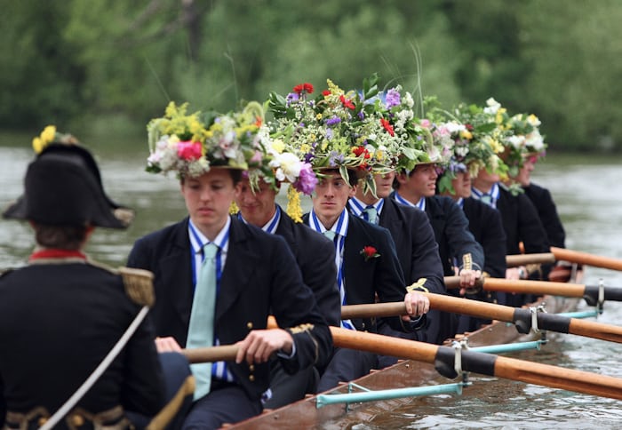 Rowers at Eton in floral headwear 
