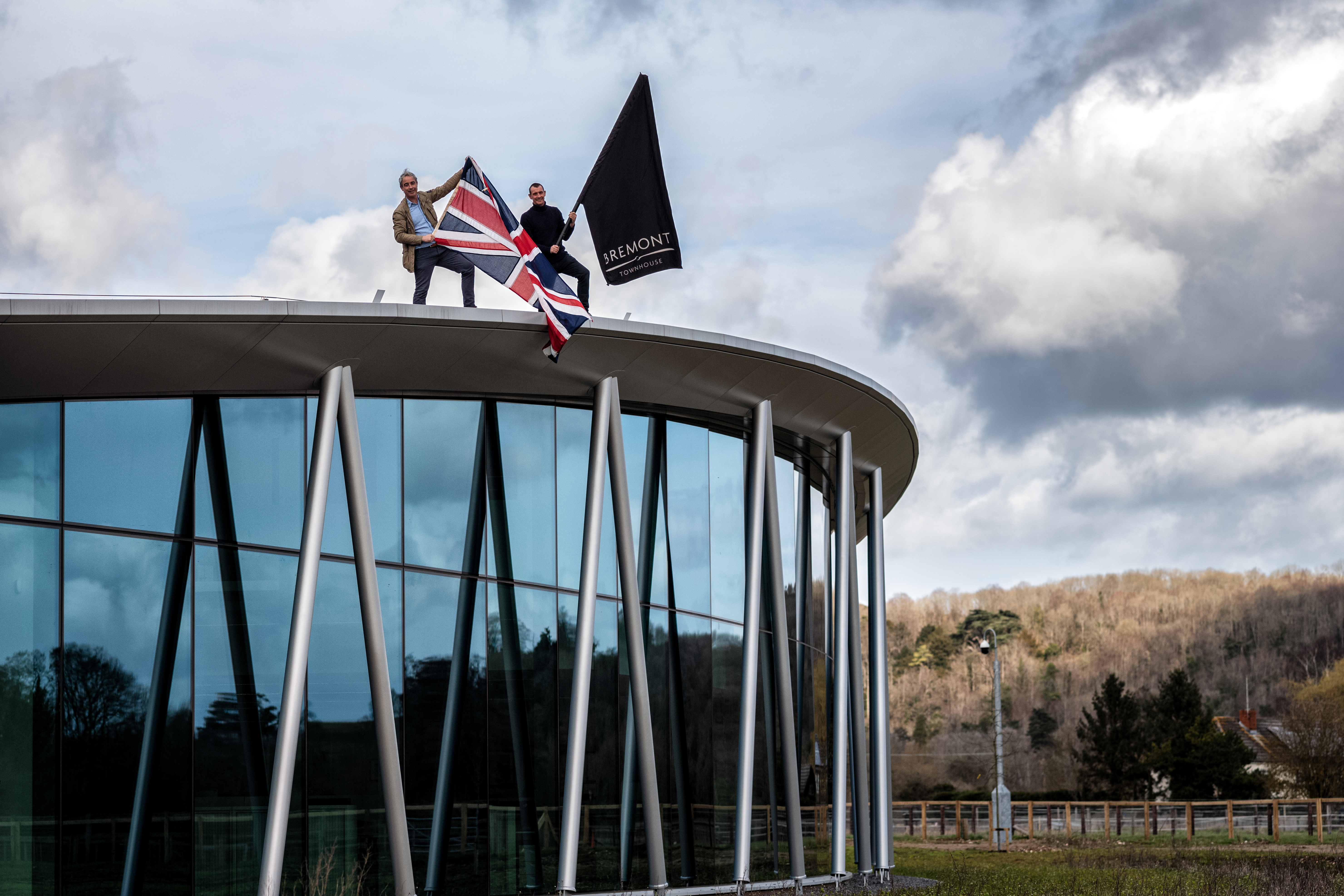 Founders wave flags over Bremont building