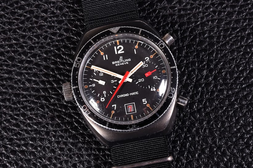 A black Breitling watch 