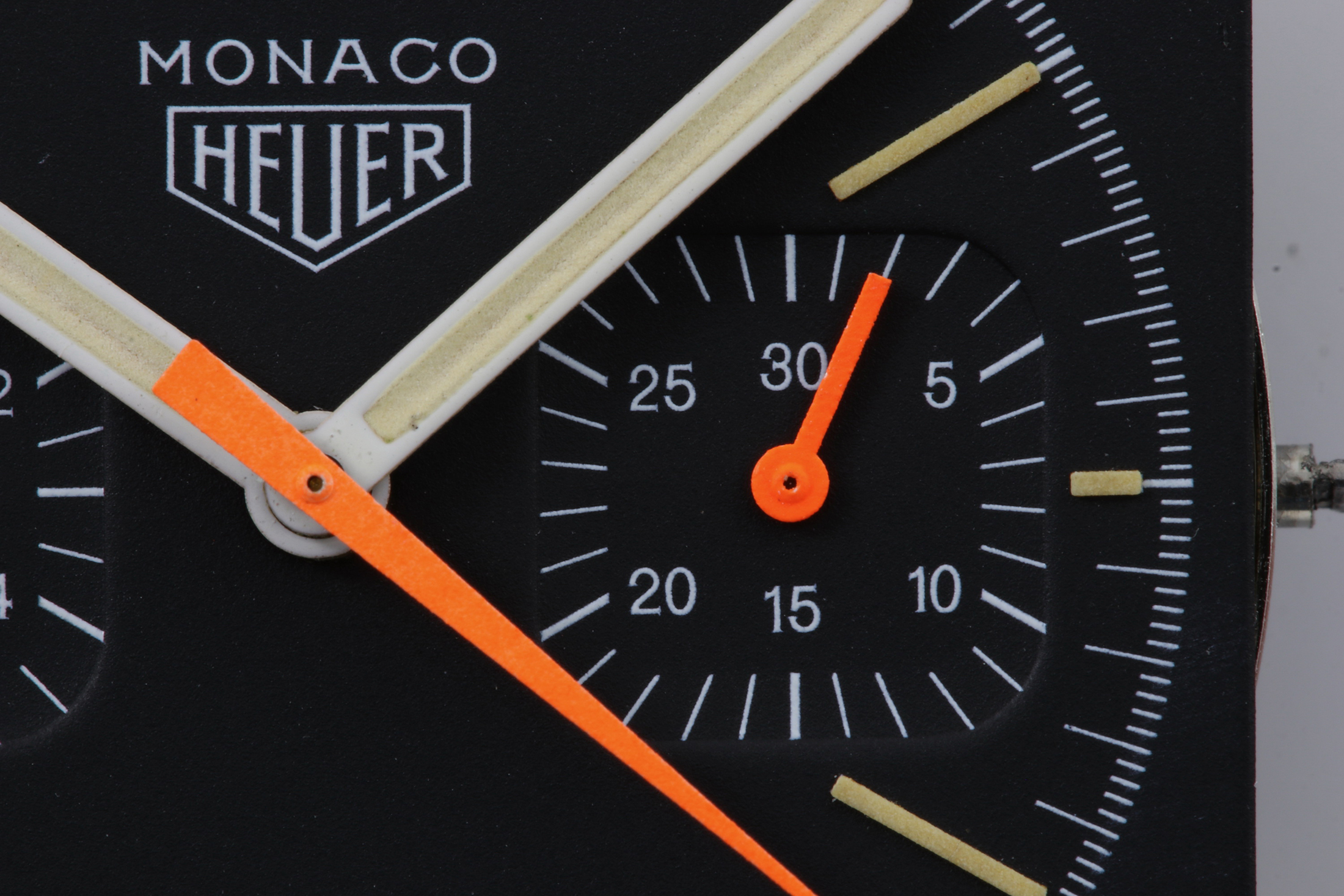 A close up on the dial of a Heuer Monaco