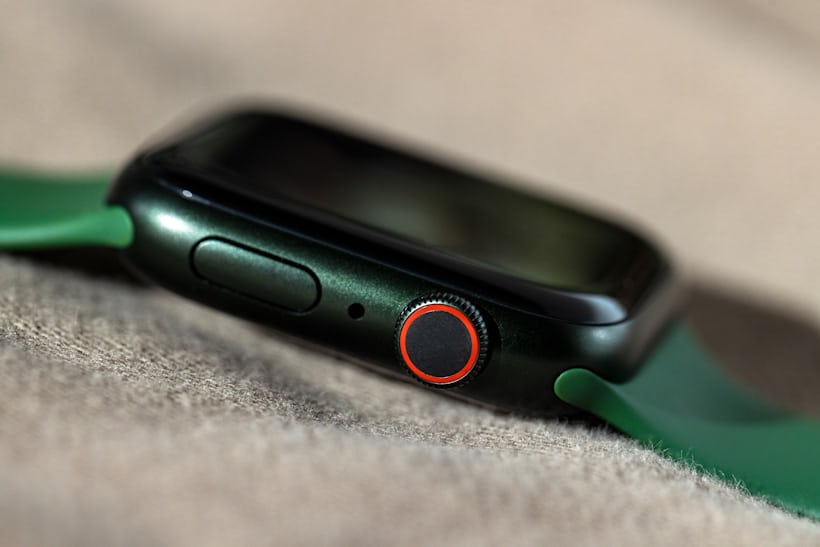 The Apple Watch Series 7, case flank, showing the crown and side button.