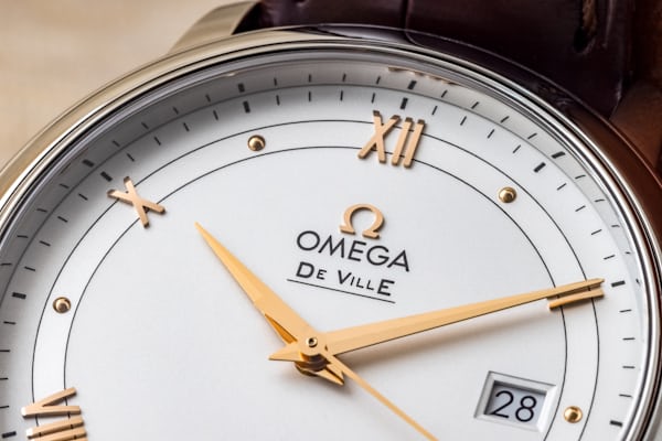 Dial closeup, Omega De Ville Prestige, showing logo