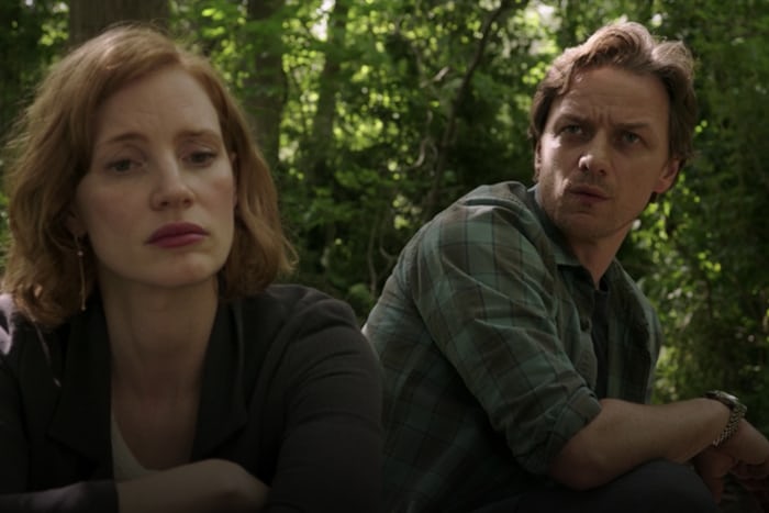 James McAvoy in his blue checkered pattern shirt that he wears throughout the movie as Bill Denbrough wearing his Rolex Datjejust next to Jessica Chastain who plays Beverly Marsh in It Chapter Two.