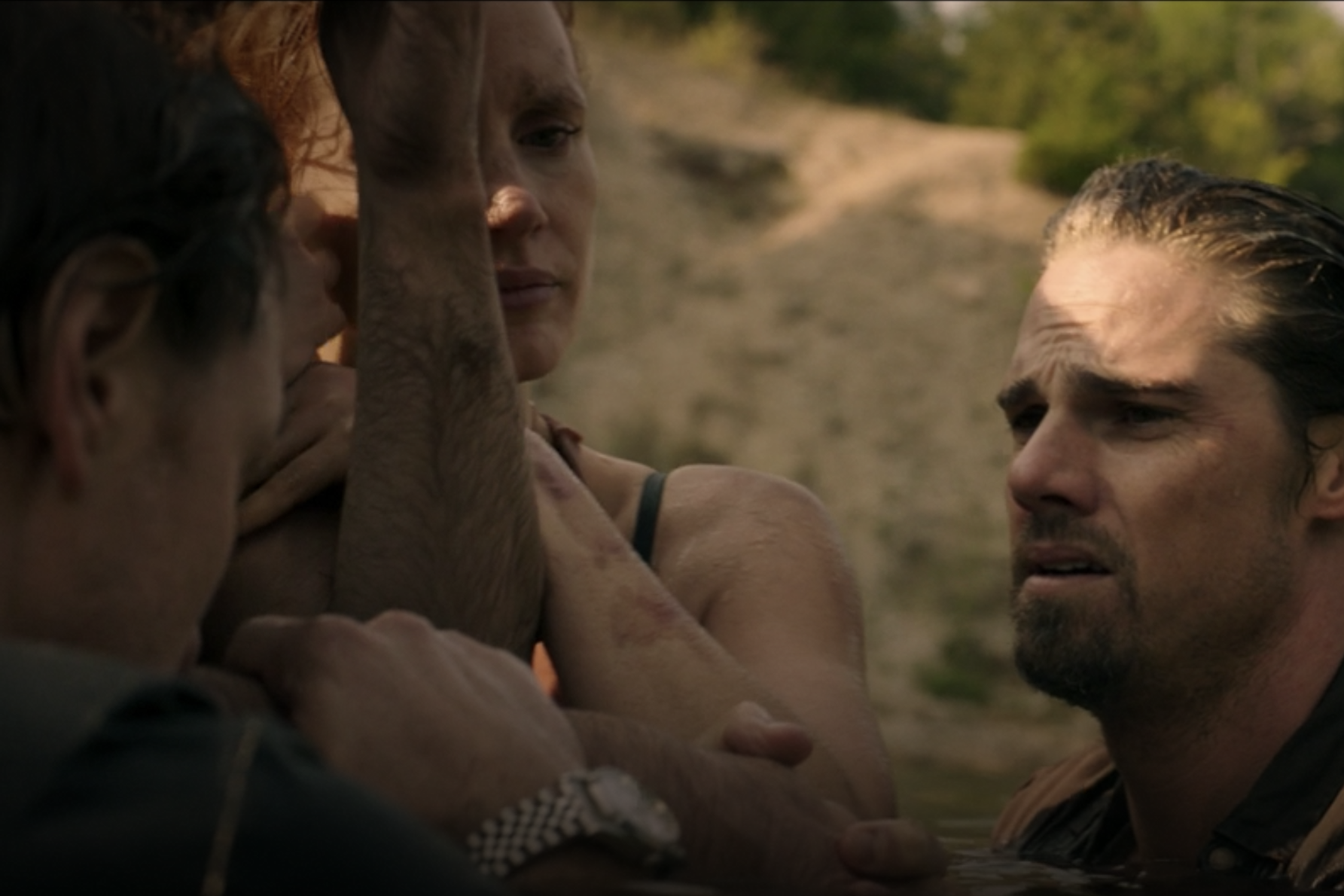 Bill Denbrough emerging from the water, holding onto this friends Beverly and Ben, with his Datejust on his wrist. 