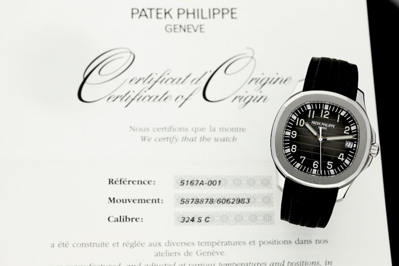 The Patek Philippe Aquanaut 5167A atop a certificate of authenticity