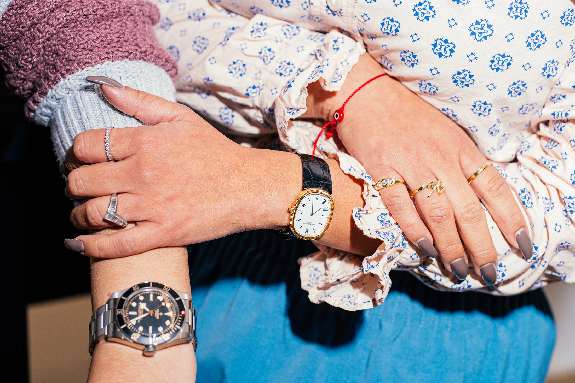 Two wrists with watches 