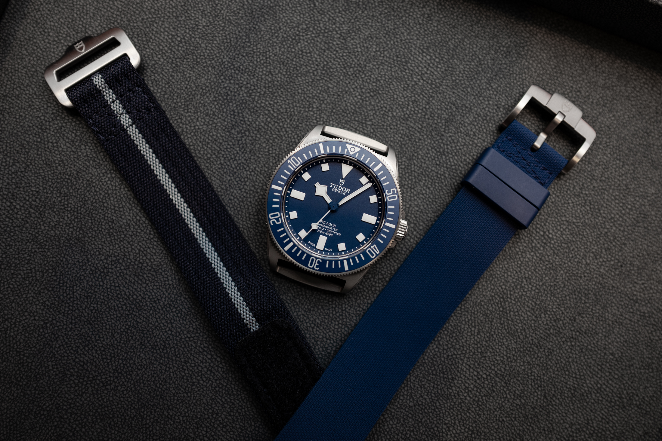 The FXD next to both of the included straps