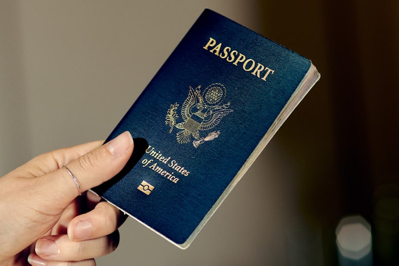An American passport in a hand