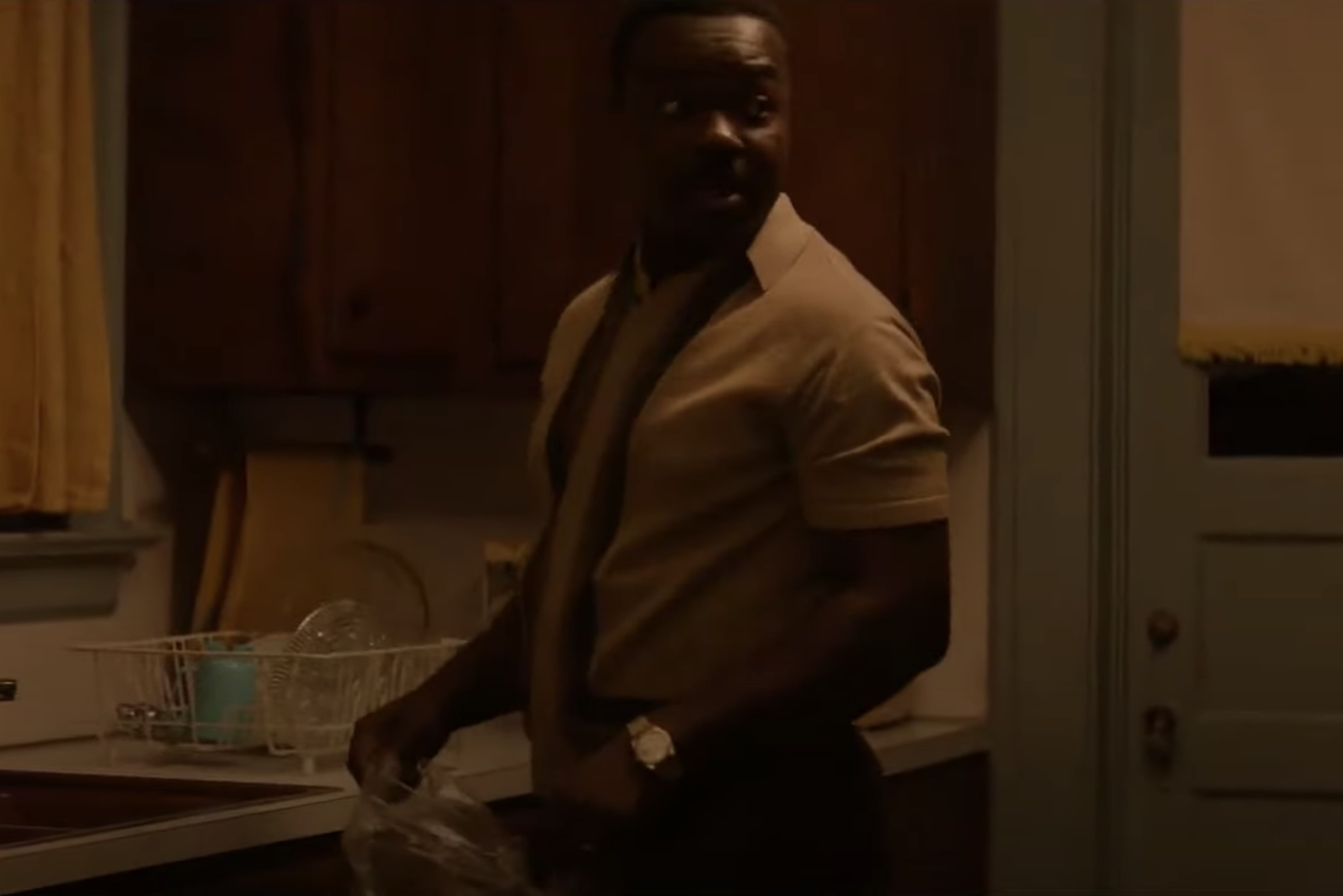 Dimly lit photo of MLK Jr. in his kitchen wearing his Datejust in Selma