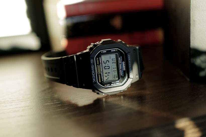 A Casio G-Shock on a table in the sun.