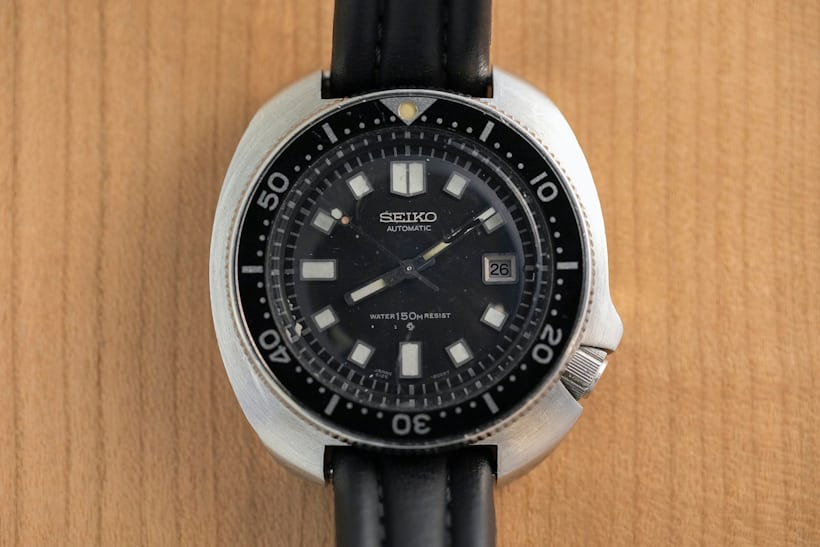 A Seiko watch on a black strap 