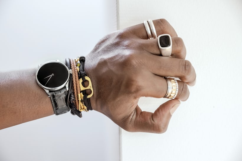 H. Moser Venturer Vantablack on a wrist with bracelets and rings