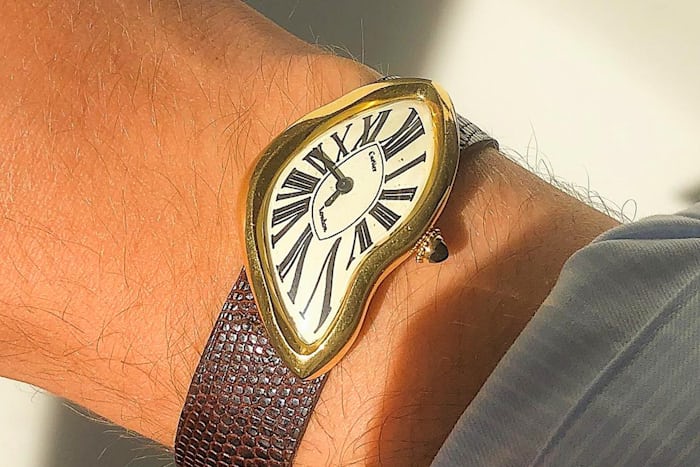 A Cartier Crash watch on a wrist