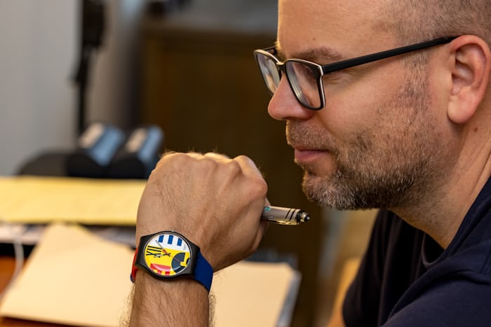 Writer Adam Wade wearing his Swatch watch.