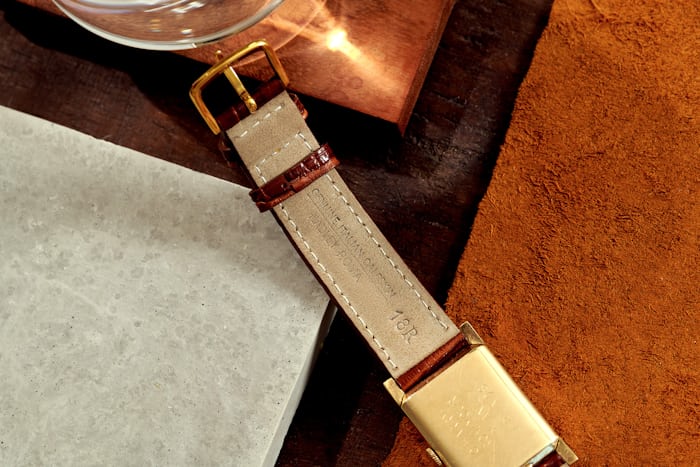The back of the strap of a Longines watch 
