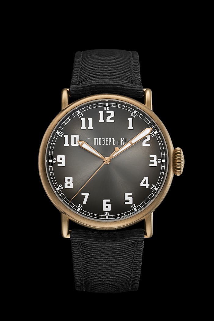 An H. Moser watch on a black strap 