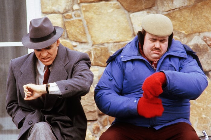 Steve Martin and John Candy checking the time