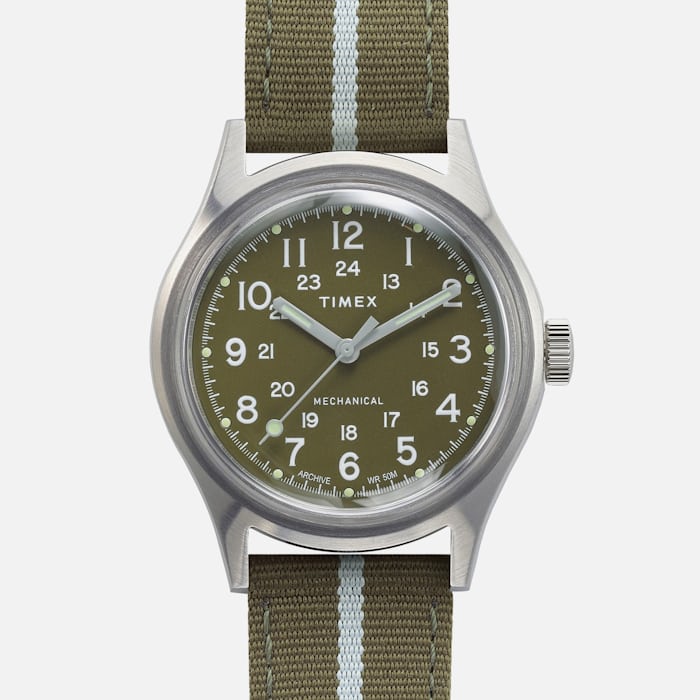 A green Timex MK1 Mechanical watch on a white background 
