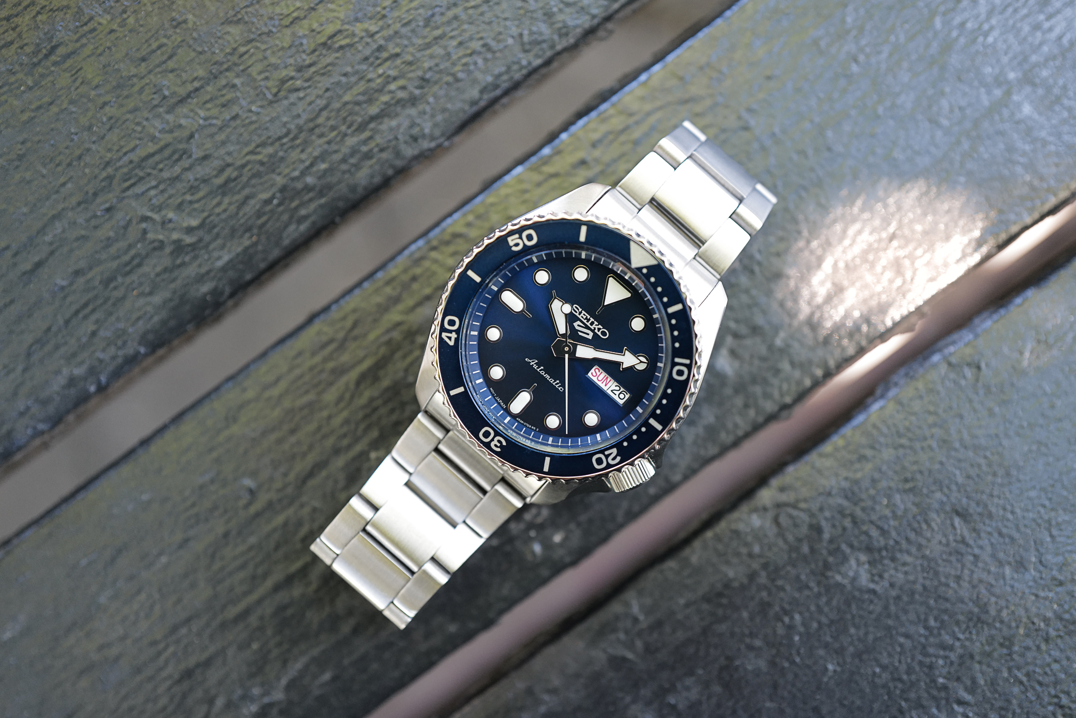 Seiko 5 Sports SRPD87 on a bench