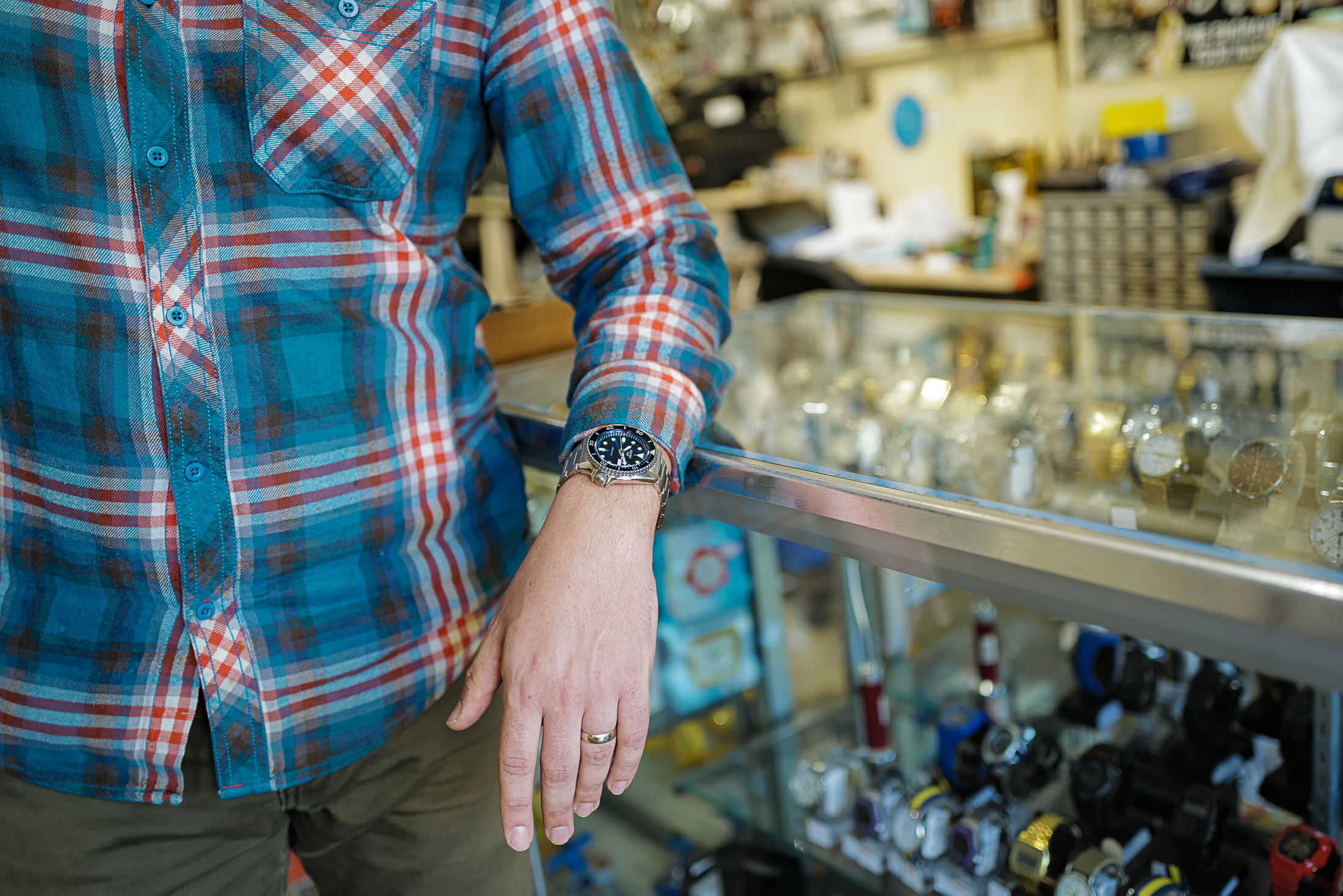 Inside the watch repair shop with the Seiko 5 Sports SRPD87 on wrist