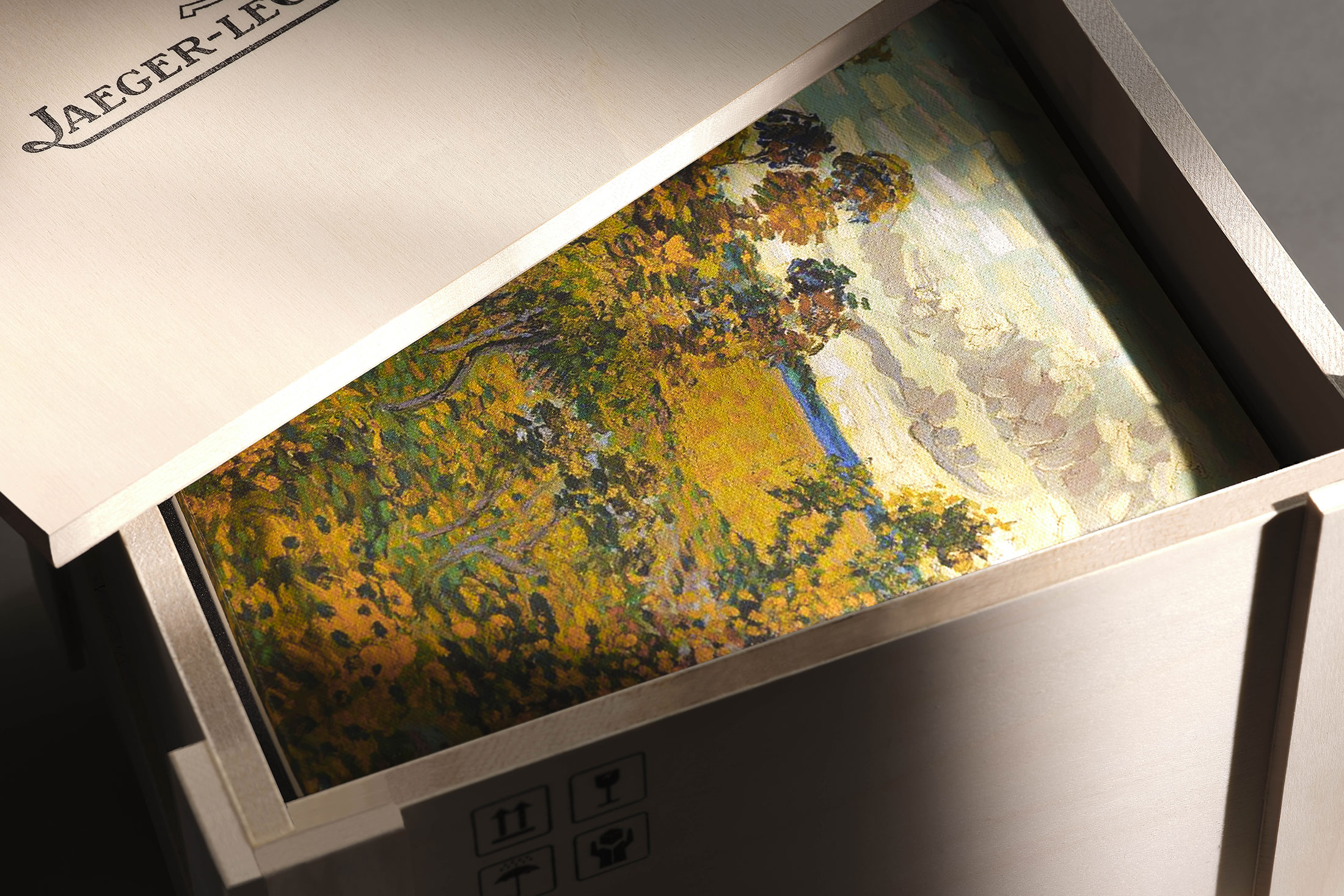 A painting of a filed inside of a box 