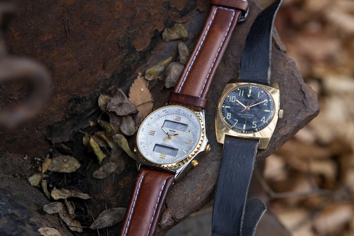 Two watches on a brick 