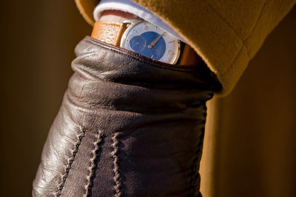 A watch and a leather glove