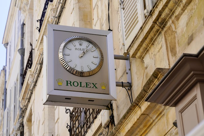 A Rolex clock on a building facade