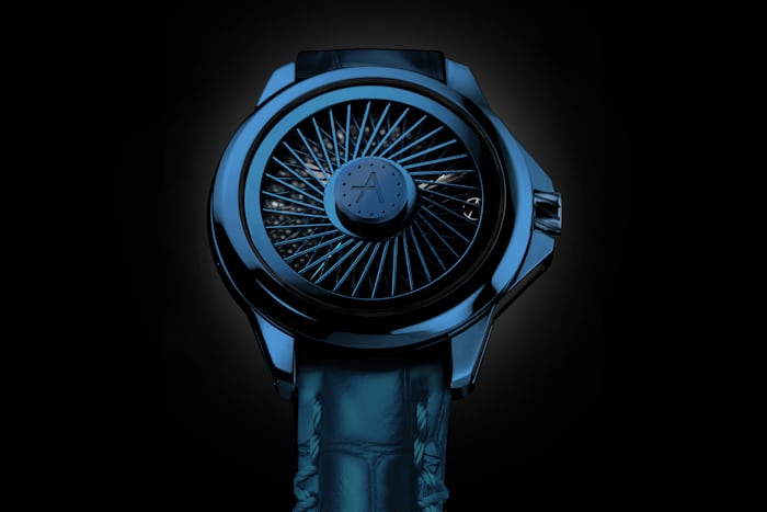 A blue watch on a black background