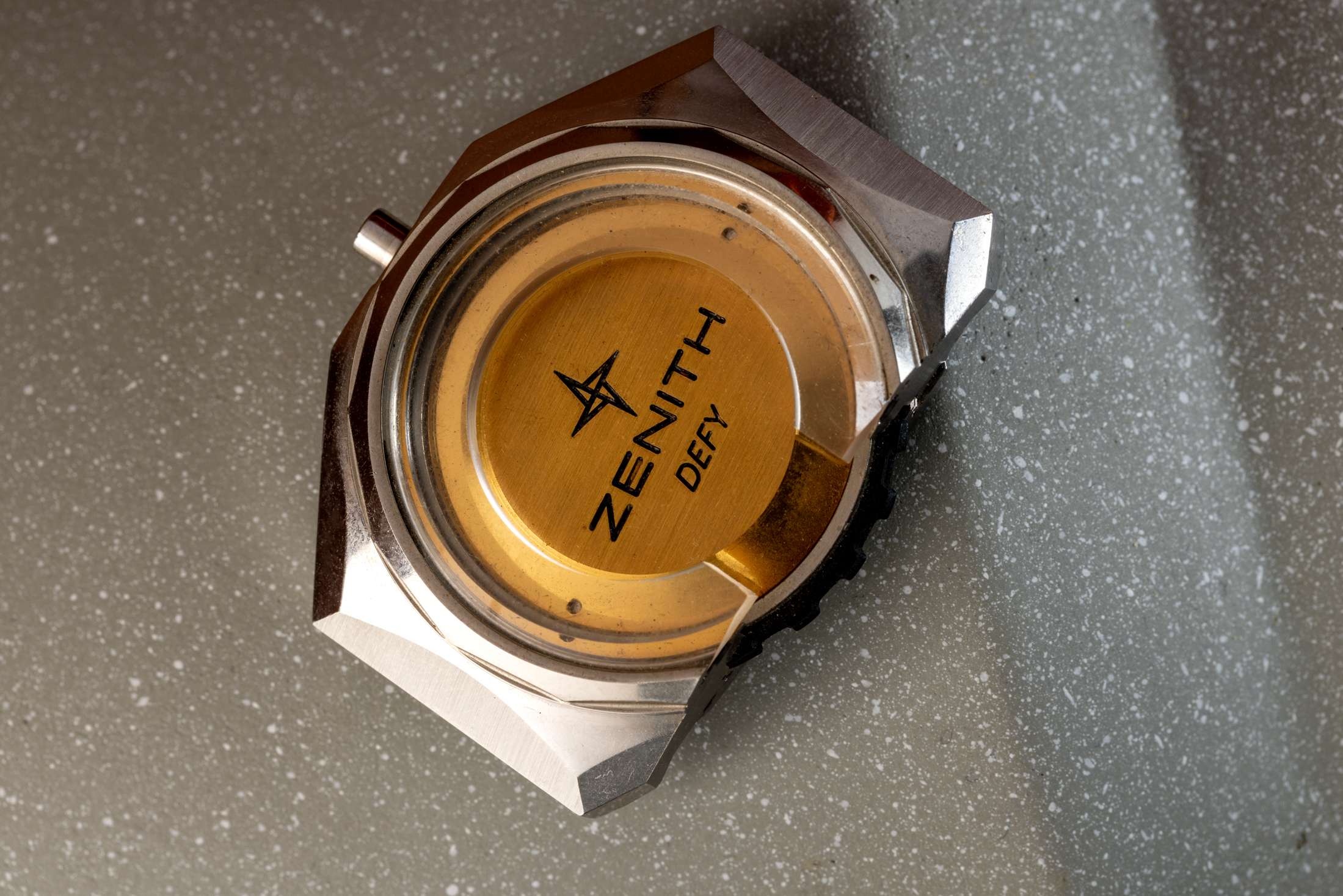 A vintage jewelers' sample featuring the original three-part Zenith Defy case.