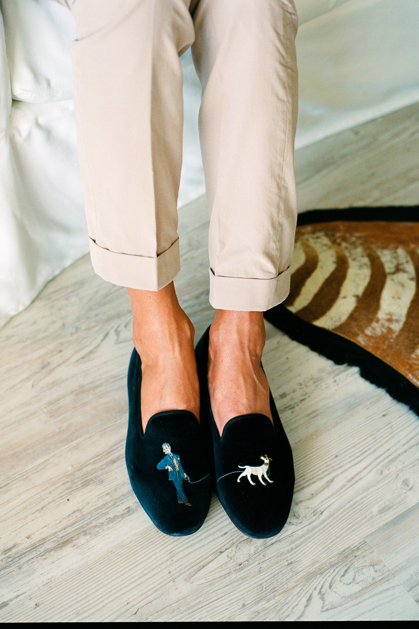 A person wearing velvet slippers