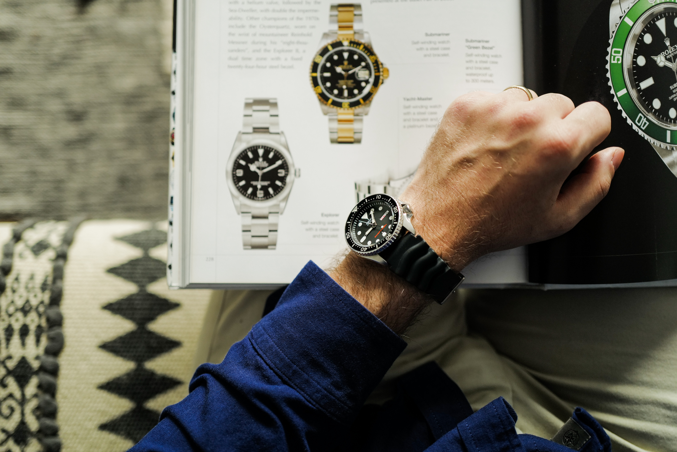 Seiko SKX007 and a Rolex book