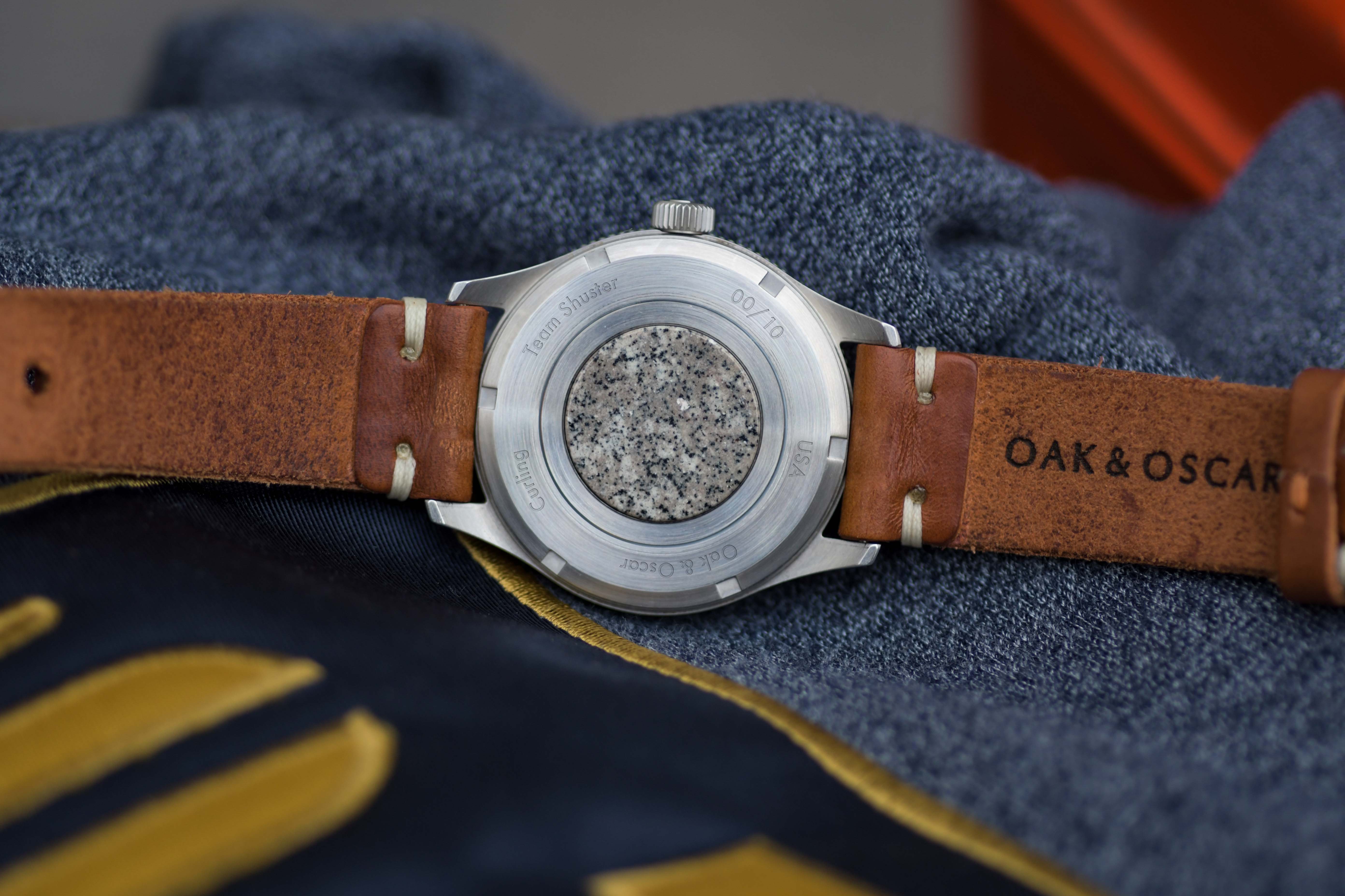 curling stone in caseback