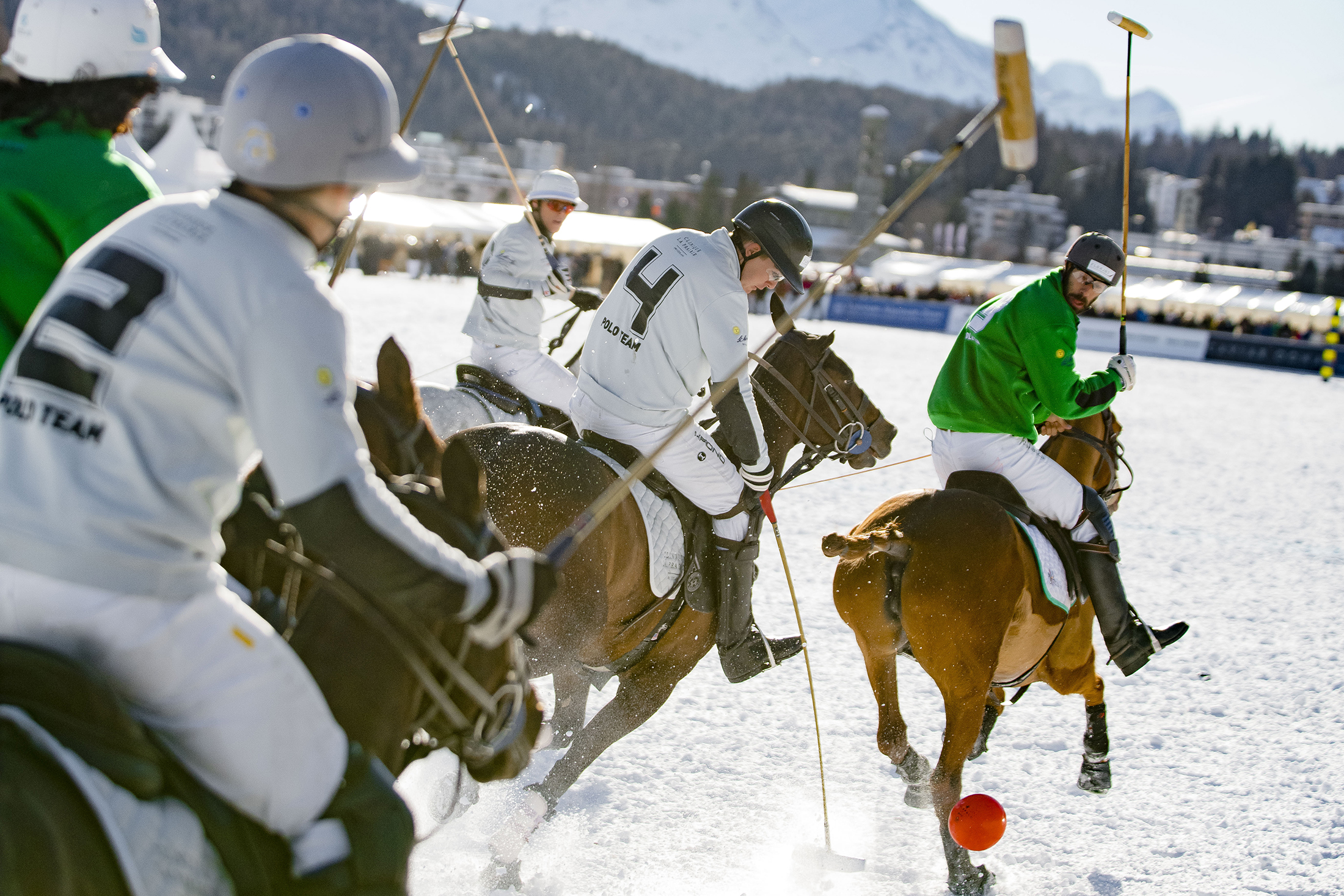 People playing snow polo 