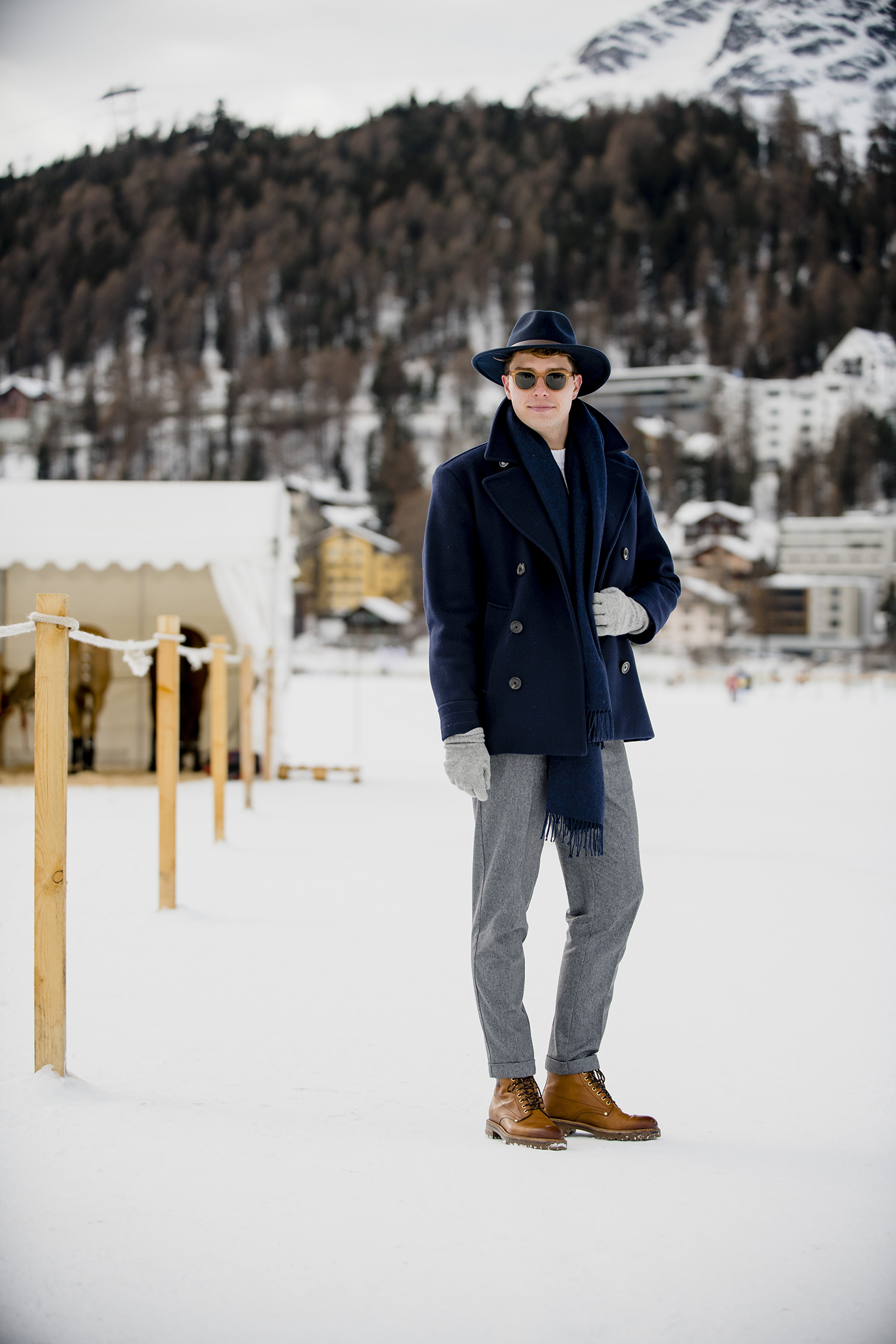 A person in a blue coat in the snow 