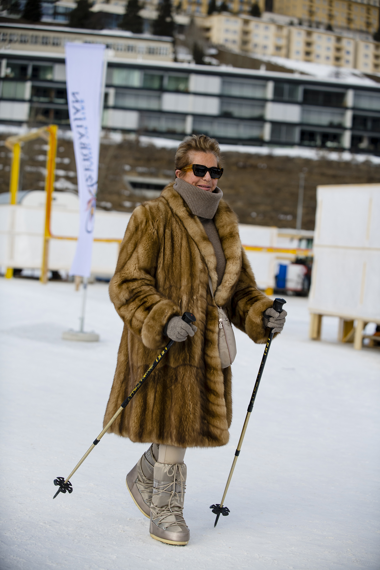 A person in a fur coat in the snow 