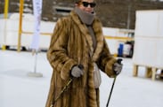 A person in a fur coat in the snow 
