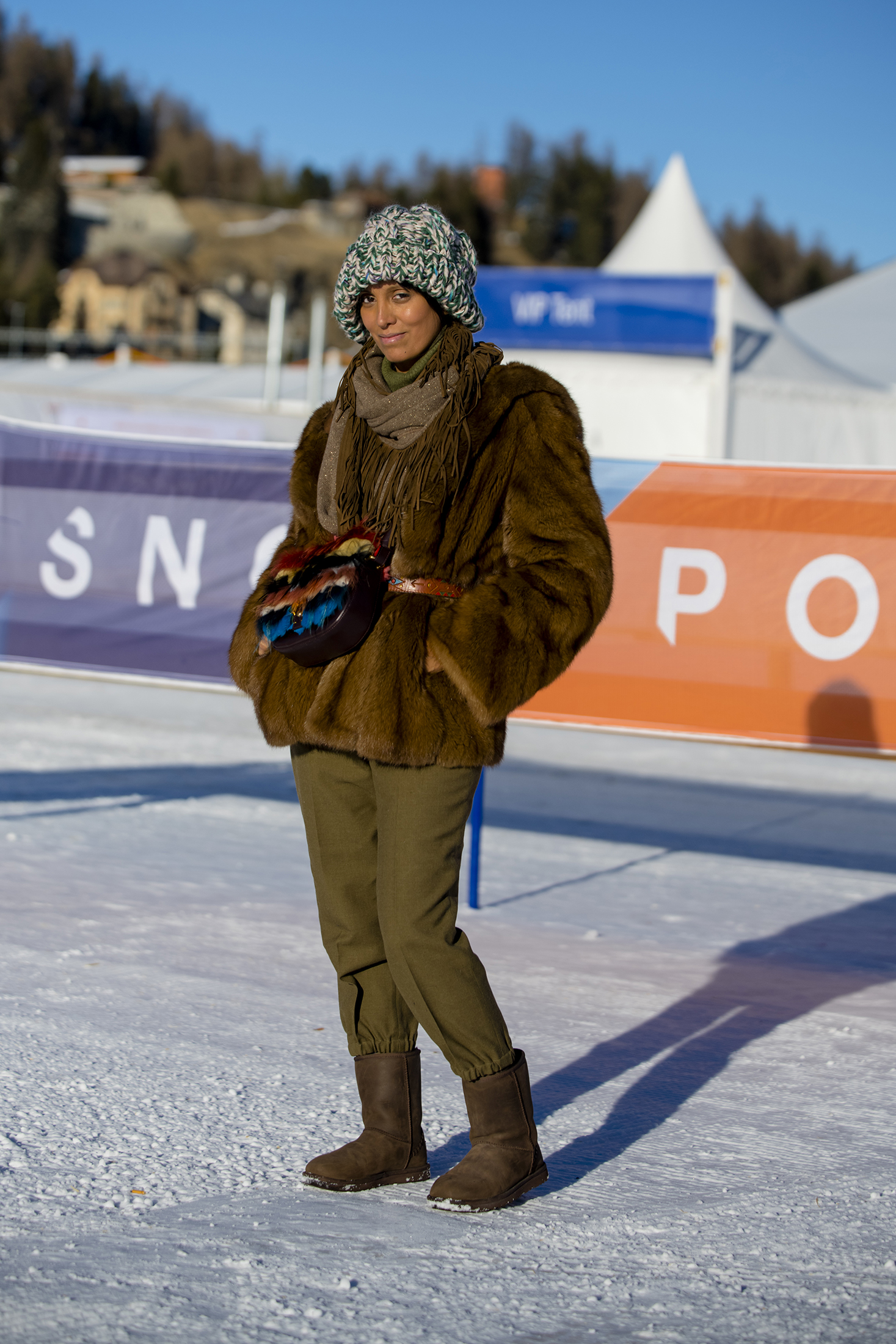 A person in a fur coat in the snow 
