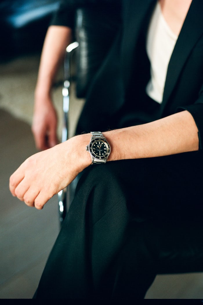 A Rolex Submariner watch on a wrist