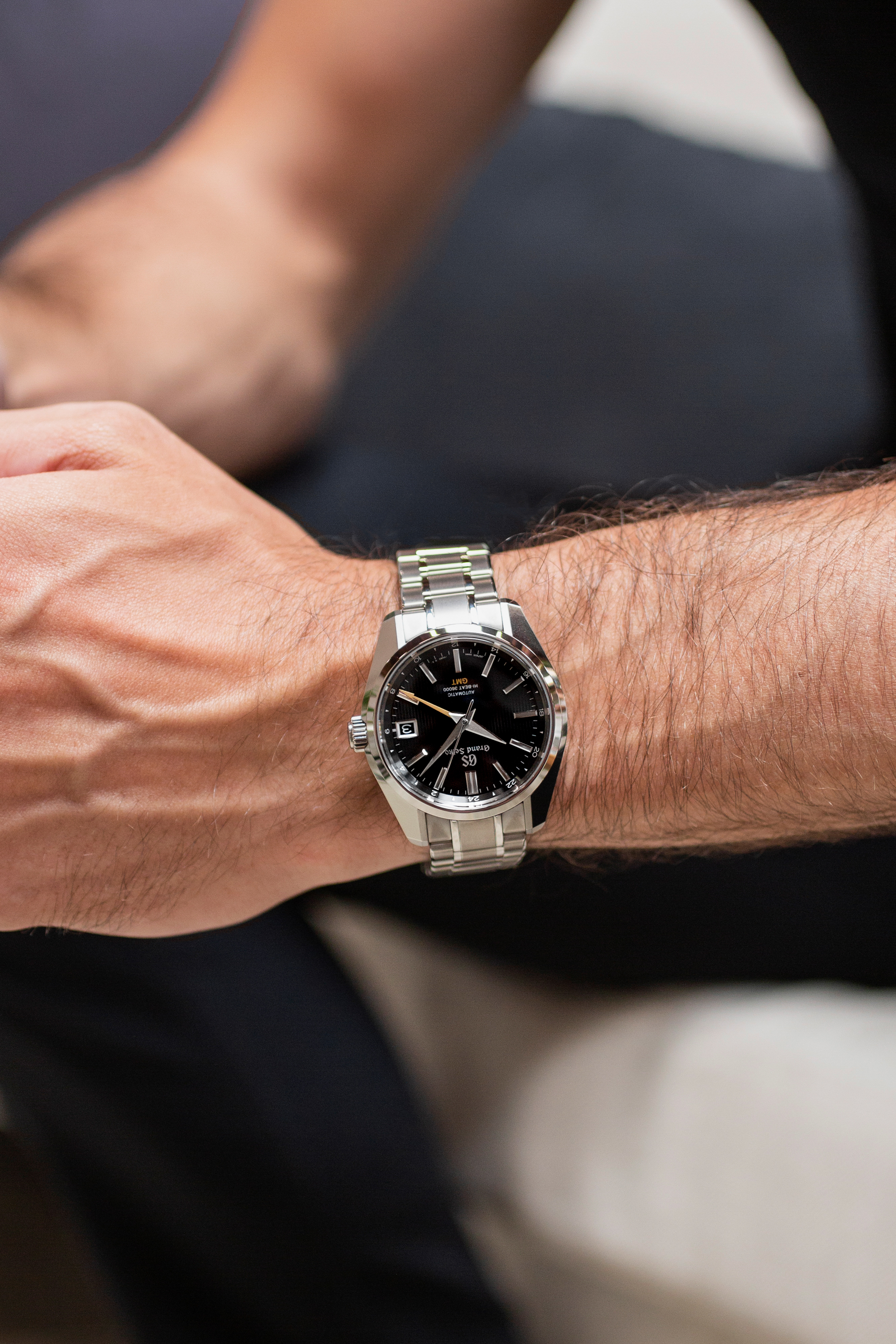 A Grand Seiko Hi-Beat GMT on the author's wrist. 
