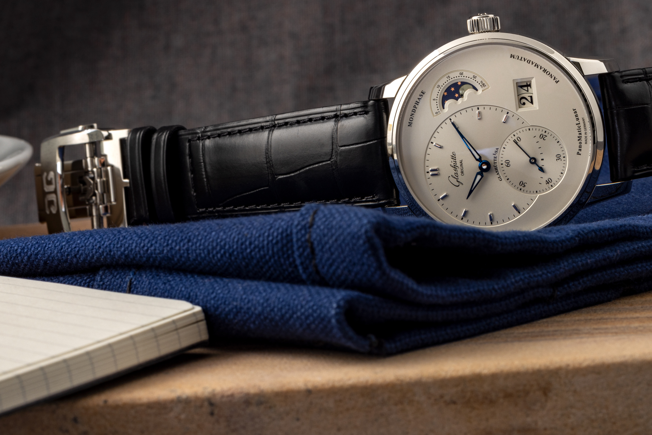 The Glashütte Original PanoMaticLunar ref. 1-90-02-42-32-05 on its side.
