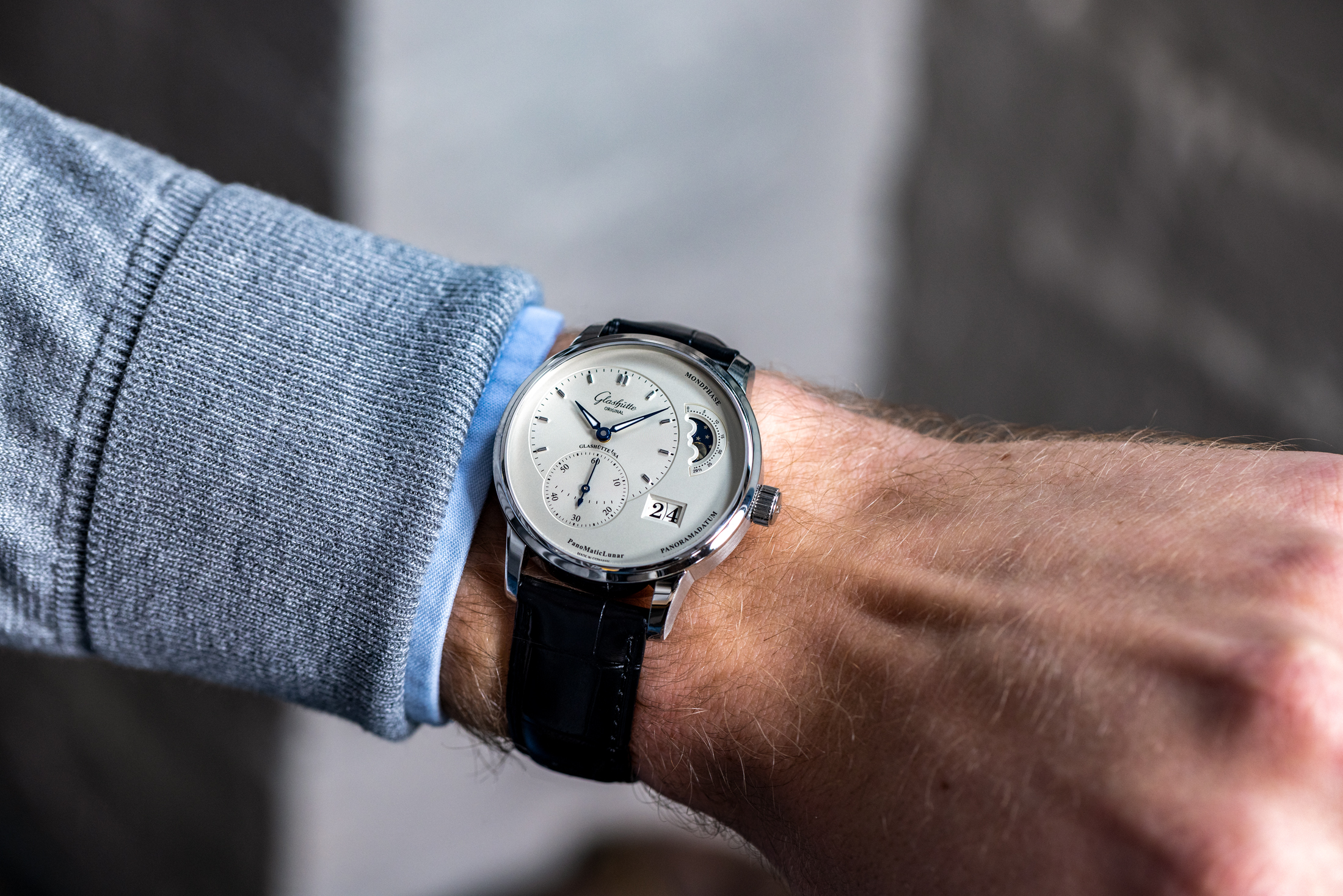 A man wears the Glashütte Original PanoMaticLunar ref. 1-90-02-42-32-05