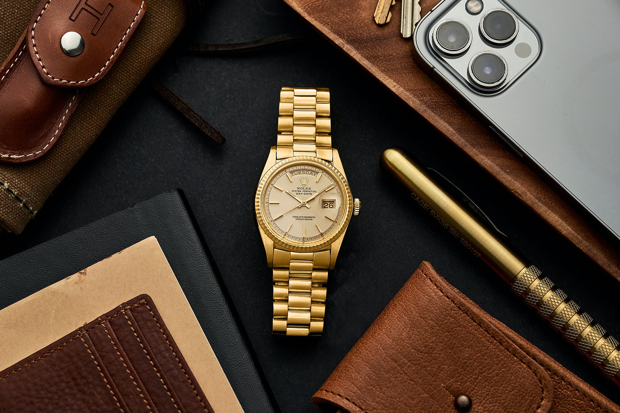 A yellow-gold Rolex Day-Date lifestyle image.