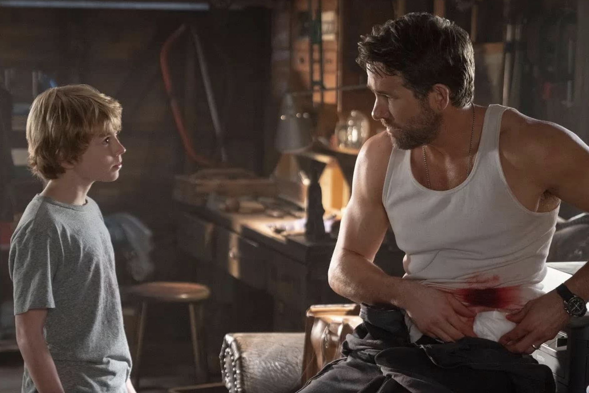 The two Adams (Walker Scobell and Ryan Reynolds), a Speedmaster and a time travel wound in The Adam Project.