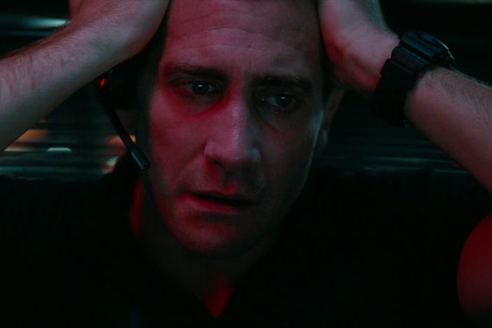 Joe Baylor (Jake Gyllenhaal) raises his hands to his head in frustration, revealing the strap of his G-Shock in The Guilty. 